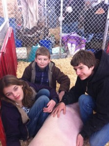 white kids with pig